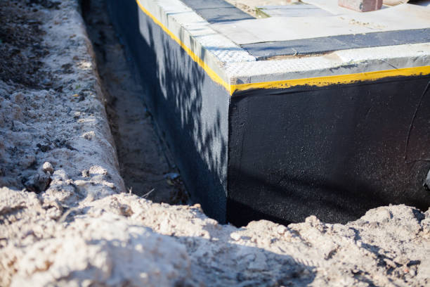 Professional Waterproofing technician working in Douglas, MI